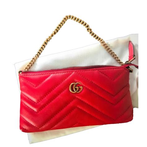 red gucci clutch